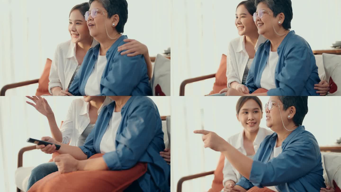 在家的美好时光:亚洲老年妇女和女儿一起看电视，充满了快乐和交谈