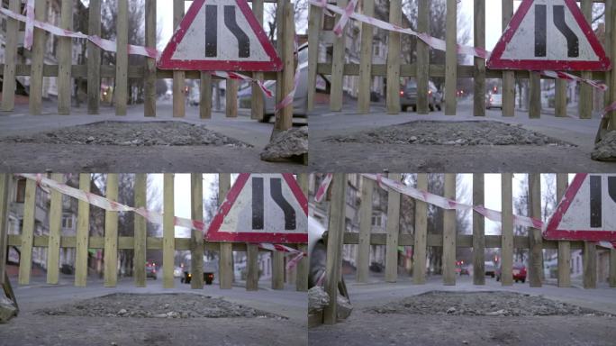 坏撕裂的道路维修道路标志在栅栏路障多莉拍摄