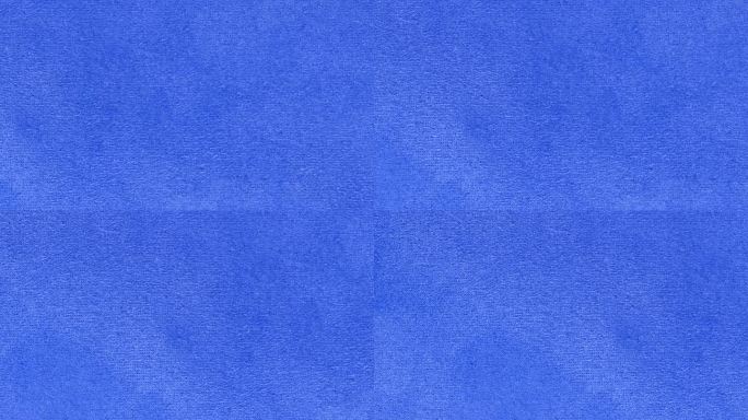 蓝色纹理织物布料特写，纺织品背景。从左到右的运动。