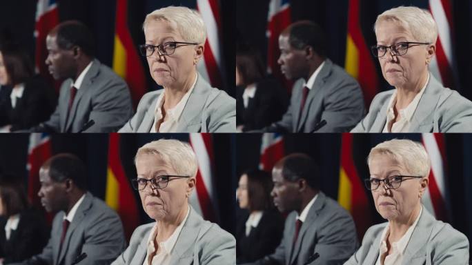 严峻的高加索女政治家在国际危机峰会上的肖像