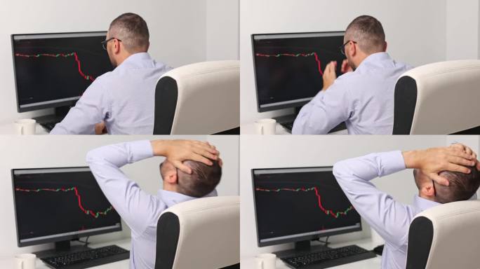 一个沮丧或疲惫的股票交易者看着显示器屏幕。