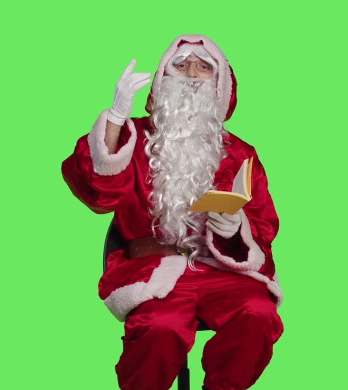垂直视频睿智的圣诞老人与讲座爱好在椅子上的正面视图