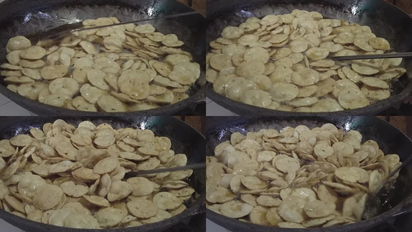 在德里的一家路边餐馆里，人们正在准备一种受欢迎的印度油炸小吃kachoris