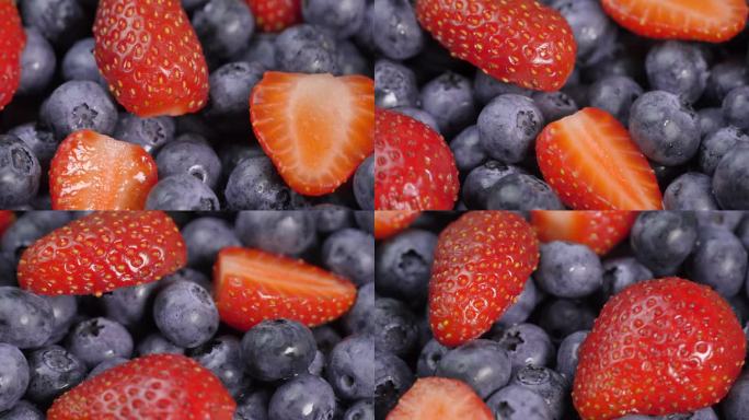 多汁的红草莓和蓝莓，俯视图。背景混合