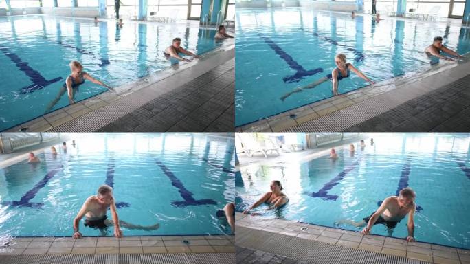 男女老年人在游泳池进行水中有氧运动