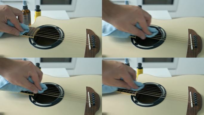 男子清洗甲板上的白色原声吉他。吉他服务理念。4k视频片段UHD 3840x2160