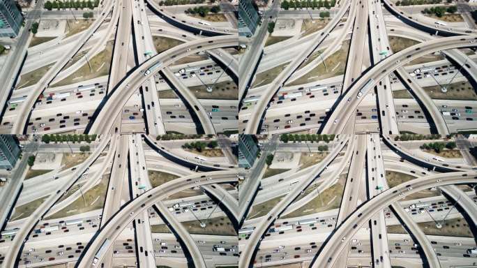 在芝加哥附近的高架公路和繁忙的立交上行驶的汽车的广角航拍照片。以上照片