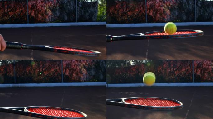 近景:网球在拍子上跳动