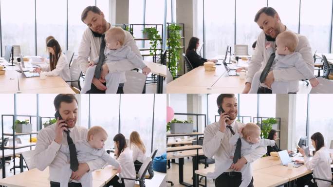 忙碌的父亲正在打电话，手里抱着他的小儿子。一群人一起在现代办公室工作。