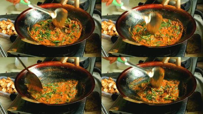 在厨房用满锅煮香辣鹌鹑蛋的过程。