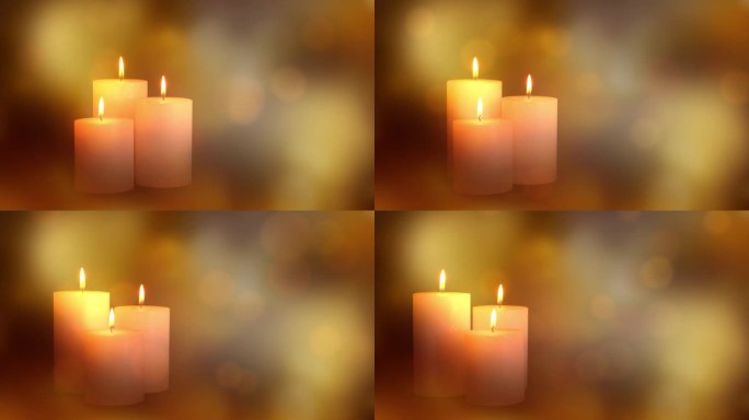 三个缓慢旋转的蜡烛灯孤立在金色散景光动画上，抽象的圣诞装饰背景与复制空间
