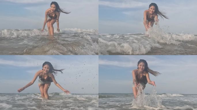 女人在海里戏水，玩得很开心