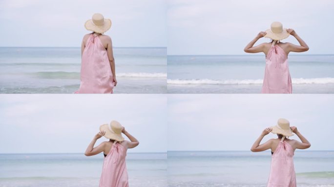 慢动作女人走向海滩，拿起她的遮阳帽，看着风景