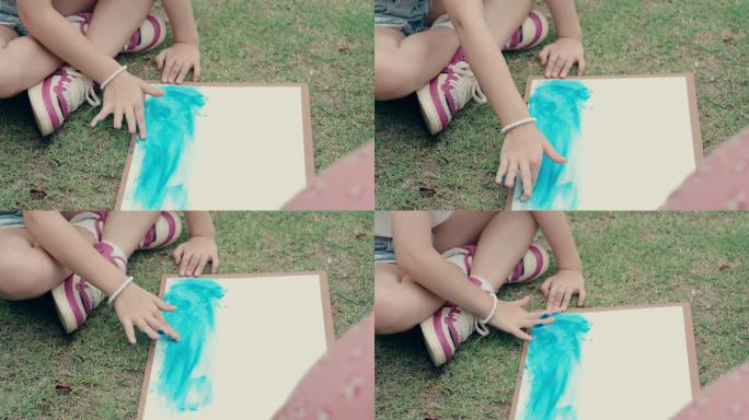 小学生与女老师学习水彩画。
