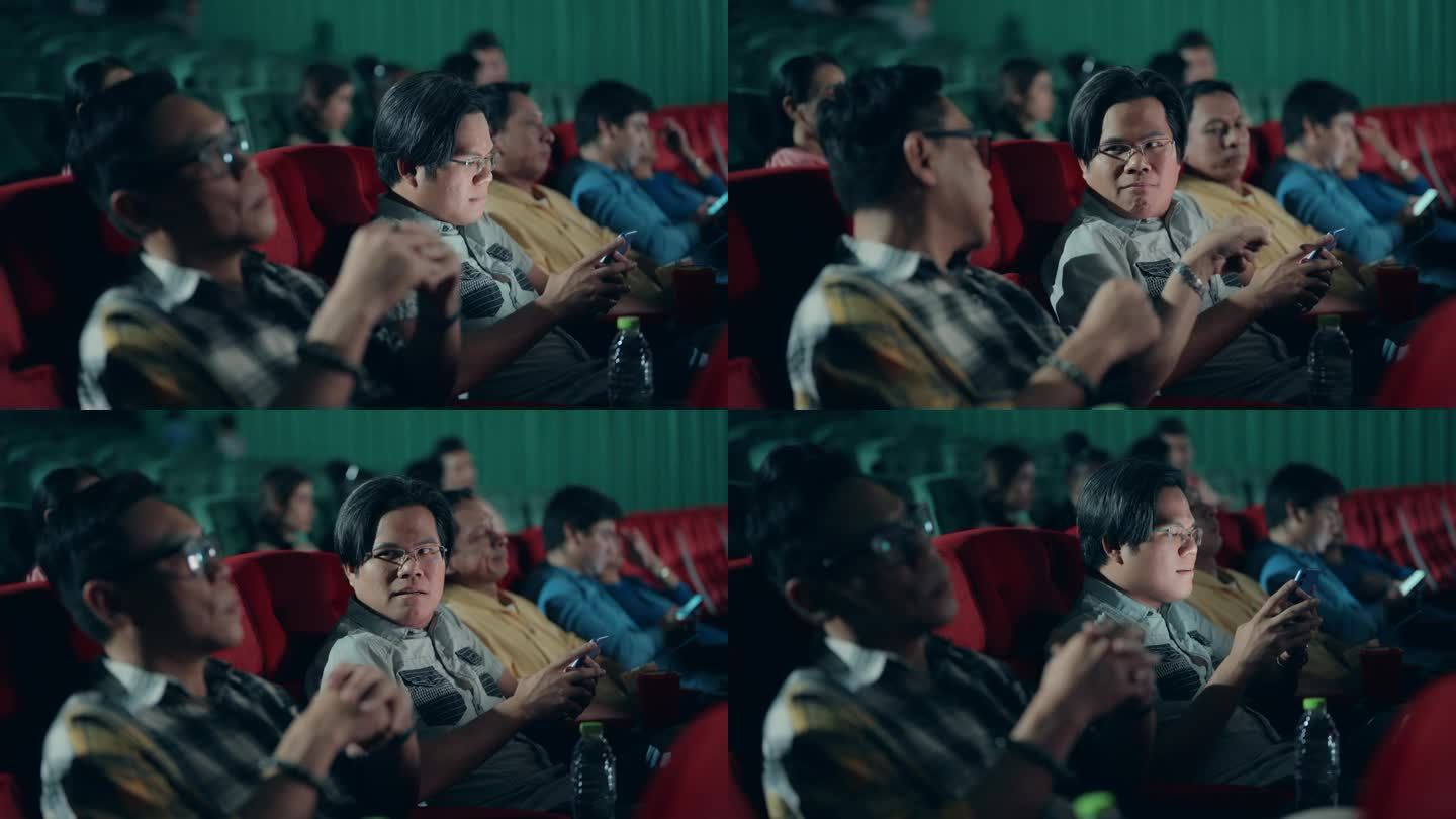 亚洲男人对在电影院看电影的时候用手机的人很恼火。