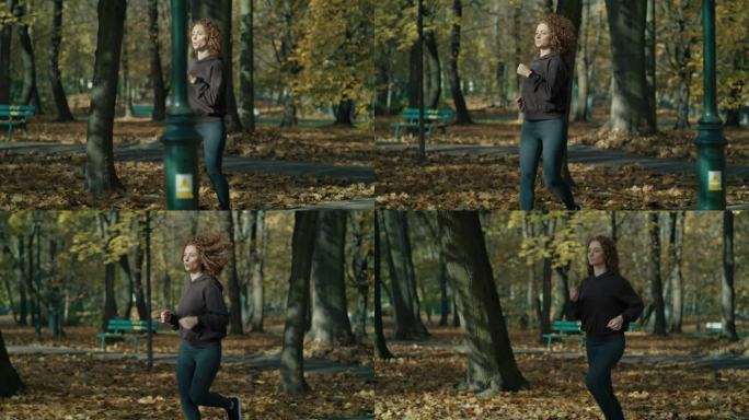 秋天在公园慢跑的白种姜色女人。用RED氦相机在8K下拍摄