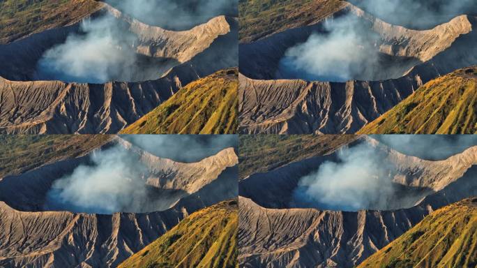 航拍无人机拍摄的日出场景，火山喷发的烟雾被云雾包围。Bromo, sememeru, Batok和W