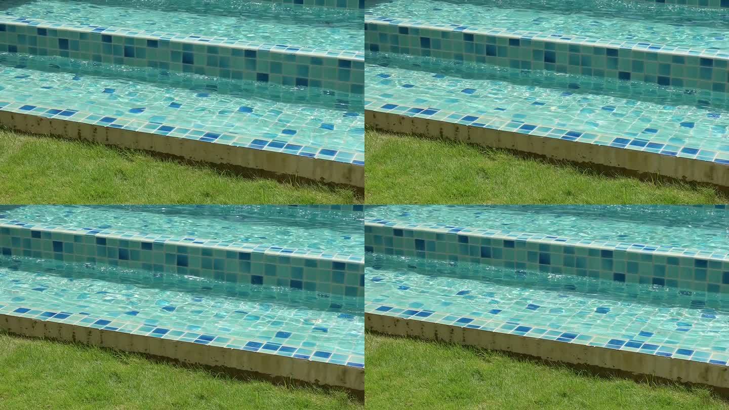 慢动作的蓝色游泳池与楼梯，淡水的背景