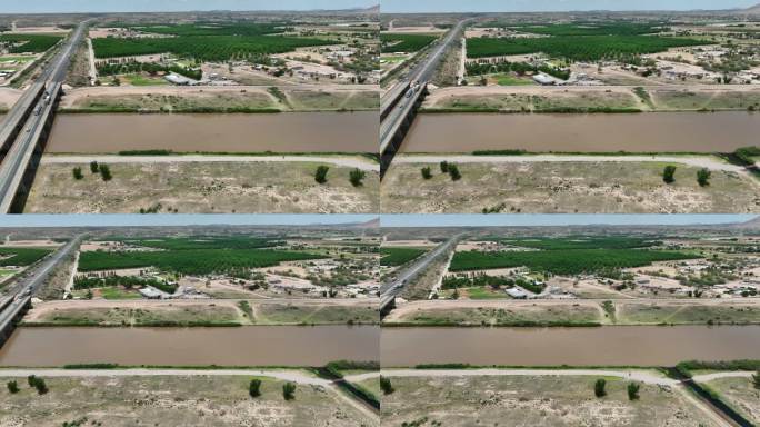 里奥格兰德在拉斯克鲁塞斯，新墨西哥州附近的山核桃果园。航拍卡车跟随美国西南部棕色泥泞的河流。