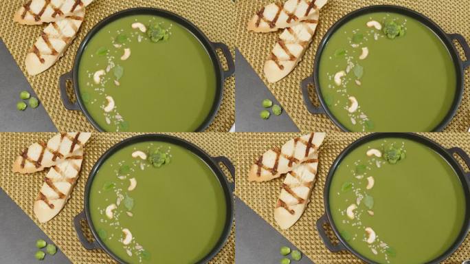 素食菠菜汤与西兰花在碗旋转在桌面视图