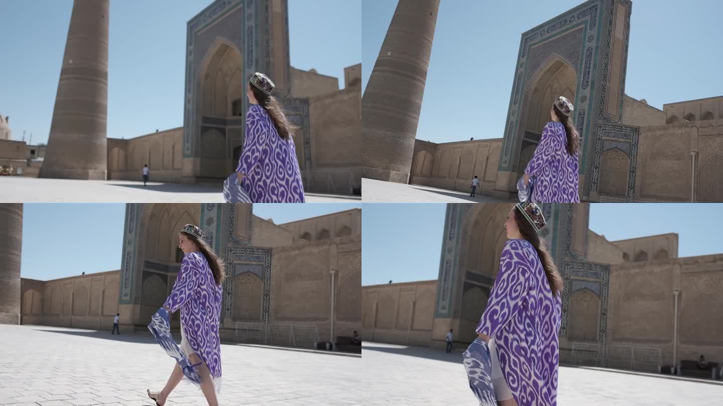 一位身穿东方长袍、头发飘逸的年轻女子沿着尖塔前的广场走着
