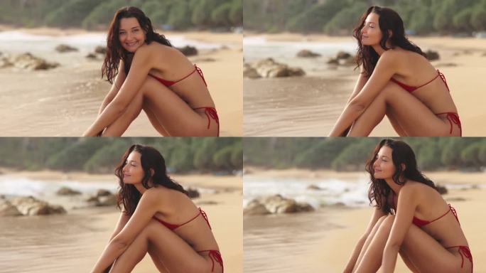 沙滩比基尼模特肖像在沙滩上的红色泳装