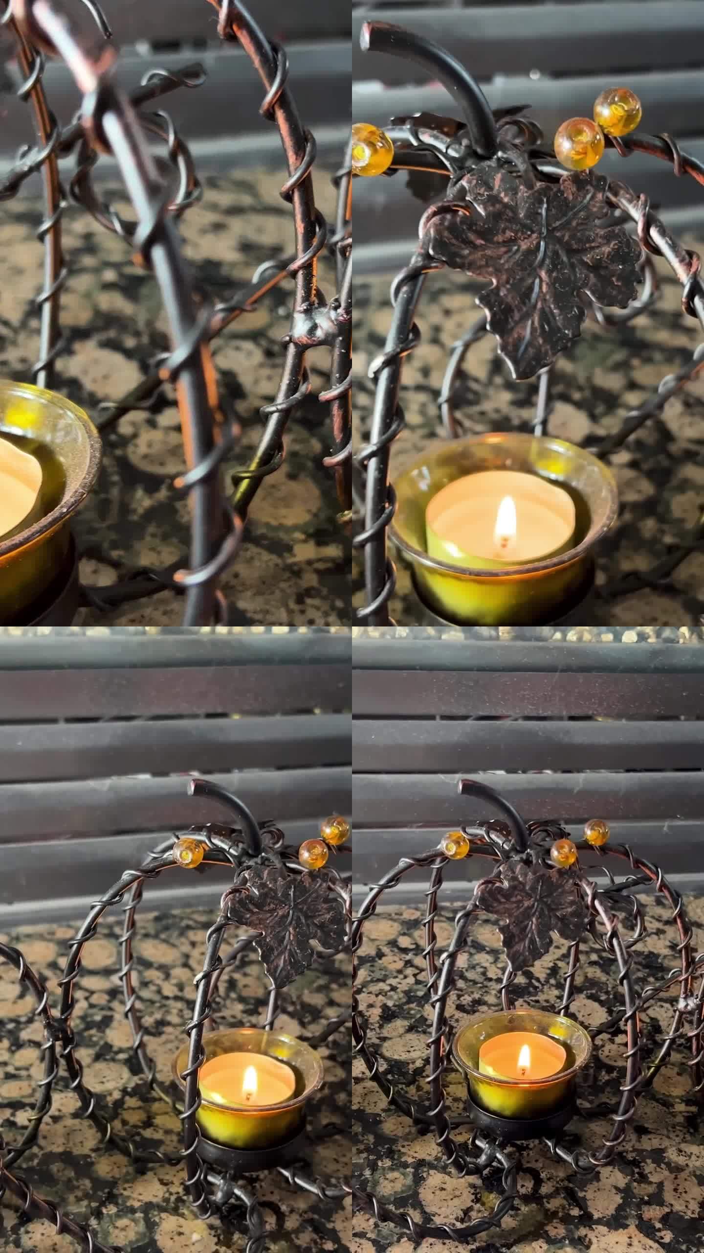 美丽的柳条铁艺3个南瓜并排站在一起，它们是透明的，在蜡烛中间燃烧