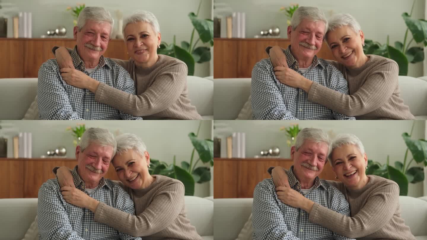 成年夫妇在家里拥抱。中年老夫老妻温柔地拥抱在一起，享受甜蜜的幸福。奶奶爷爷在一起。亲情时刻的爱和关怀