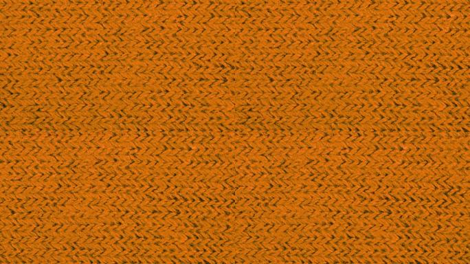 橙色纹理织物布料特写，纺织品背景。从左到右的运动。