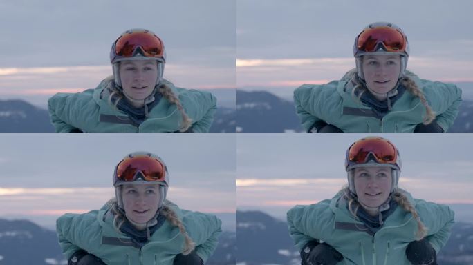 靠在滑雪杆上微笑的女滑雪者