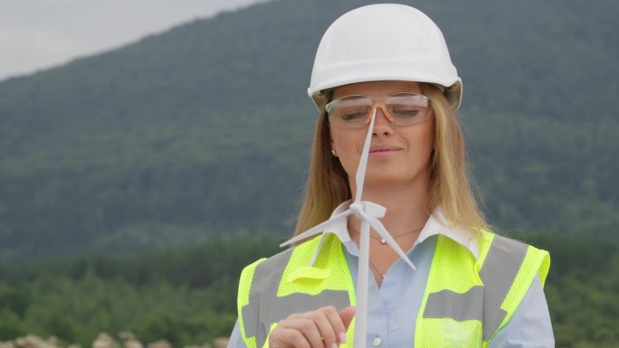 绿色未来的工程技术:一位有远见的女性制定了一项计划，利用风力涡轮机确保可持续能源。可再生能源在行动:
