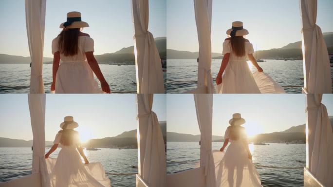 身穿飘逸的白色连衣裙、头戴遮阳帽的黑发美女，在日落时分优雅地沿着海边的木制码头奔跑。旅行，夏天的精神