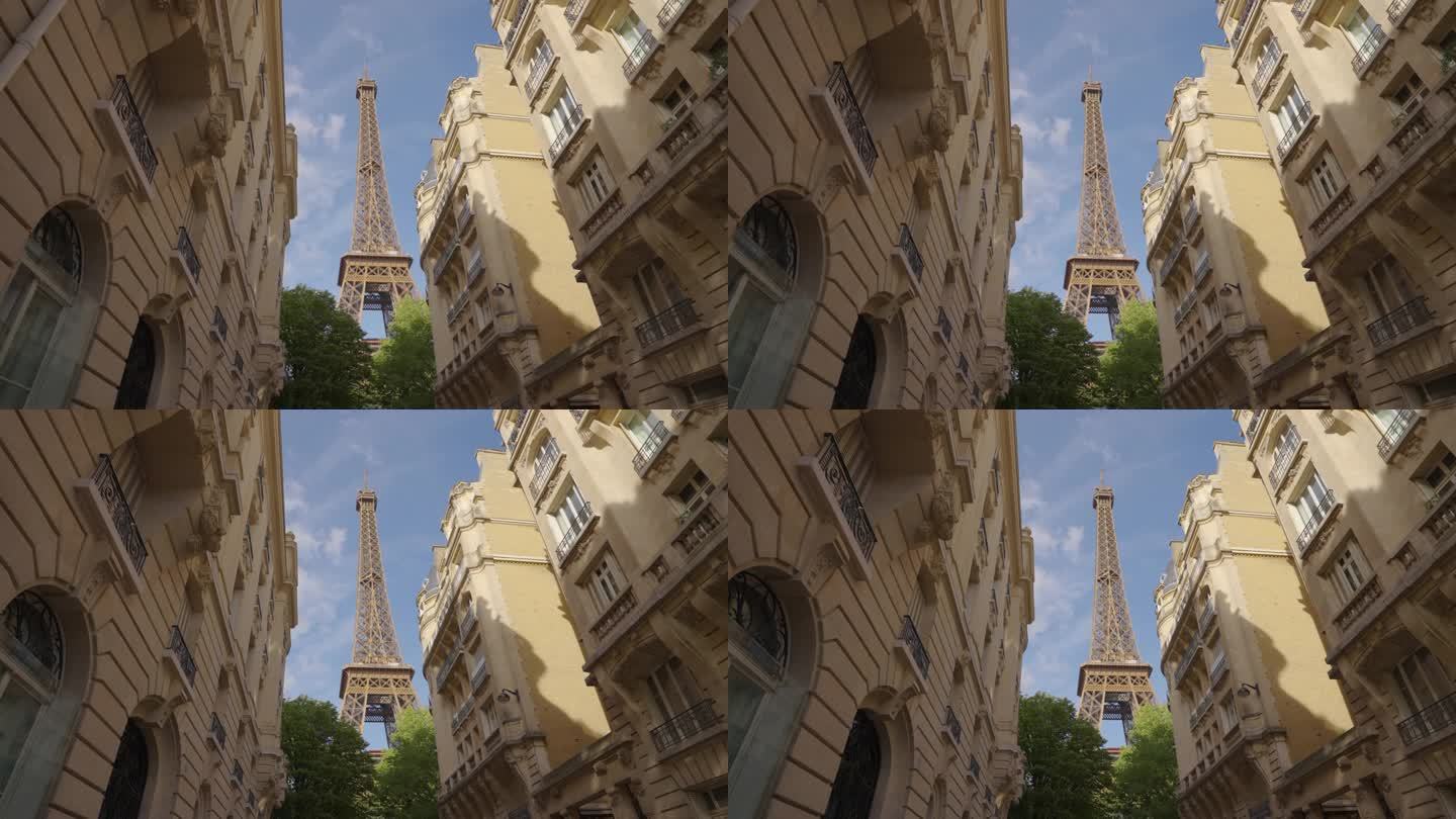 巴黎的埃菲尔铁塔在与它相邻的房屋之间