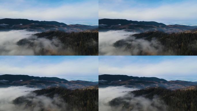 飞过山顶的云层。山峰高耸，清晨日出，自然景观优美