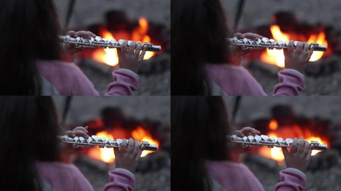 小女孩在火边吹横笛