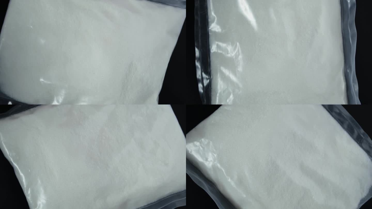 塑料袋里的柠檬酸二氢钠粉末，特写。食品添加剂E331，防腐剂和调味剂。4K视频，旋转。柠檬酸钠在食品