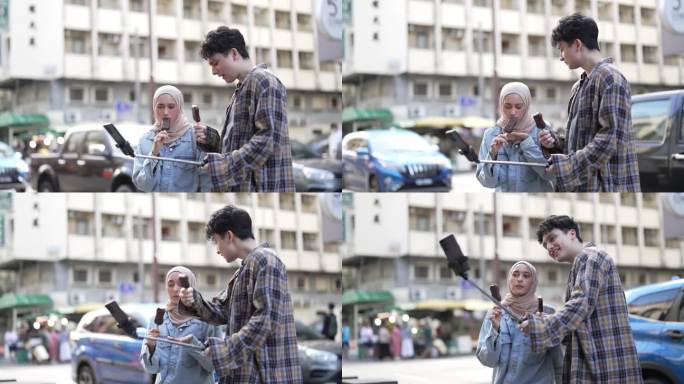 亚洲年轻人喜欢在街上用智能手机吃冰淇淋，并把它发布到社交媒体上