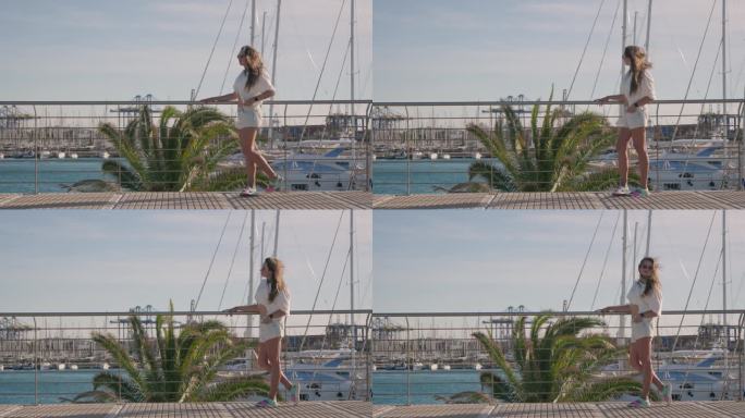 女孩站在堤岸上，一阵大风吹起了她的头发。