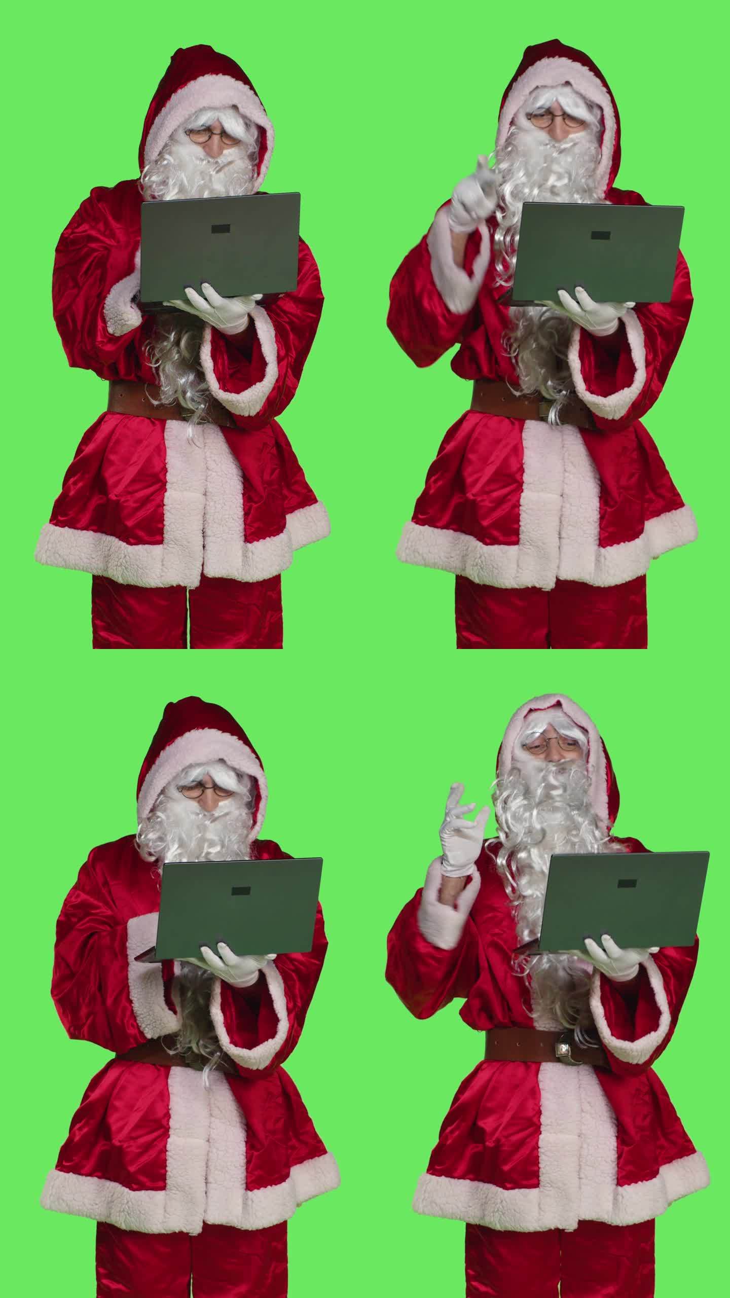 垂直视频前视图酷圣诞老人性格与笔记本电脑