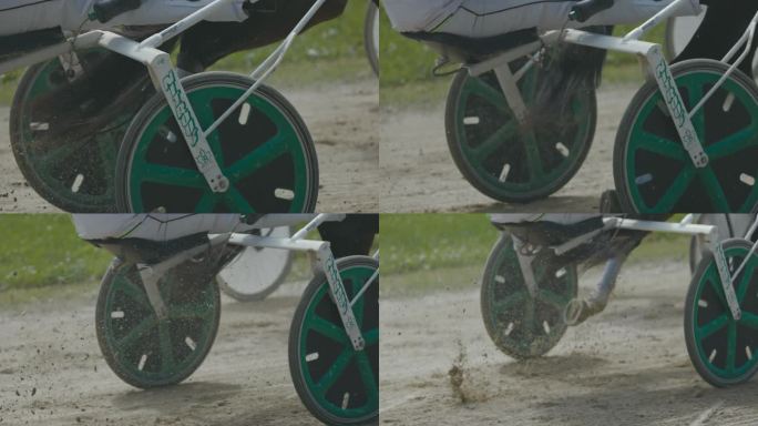SLO MO车轮的愠怒赛车通过一个角落在马具比赛