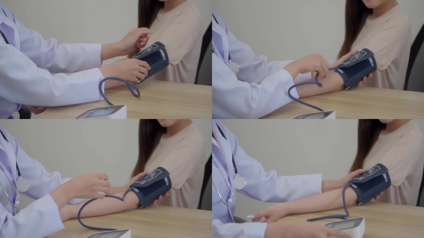 一位亚洲女医生在诊所诊室为亚洲妇女测量血压。