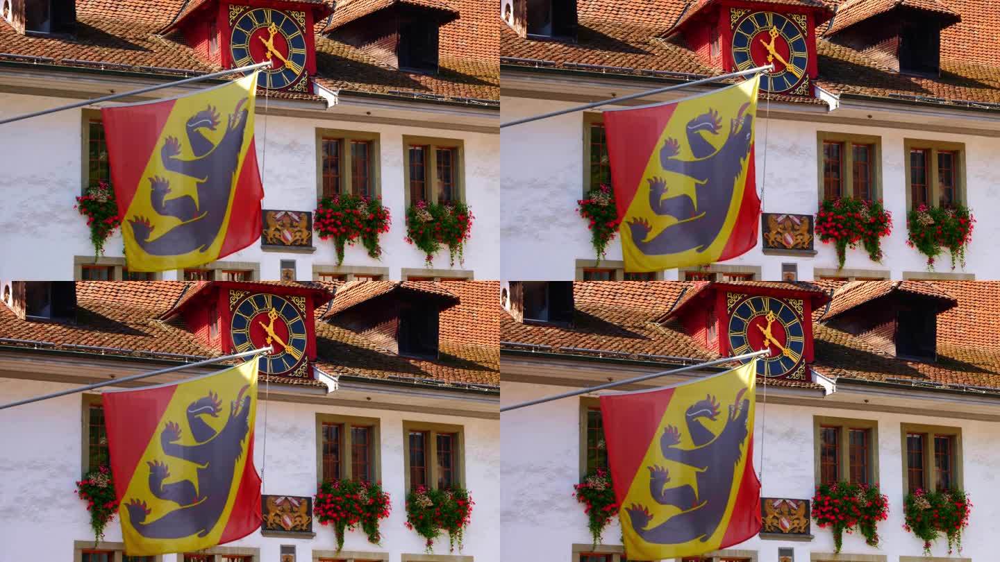 图恩市政厅的时钟、鲜花和伯尔尼州旗