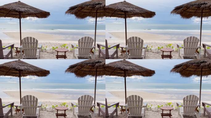 木质沙滩椅被草地遮蔽，背景是天空和海浪。