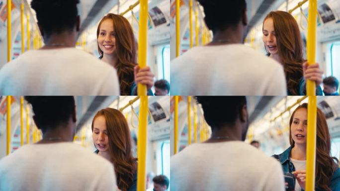 一对年轻的博主或有社会影响力的夫妇在地铁上为社交媒体旅行