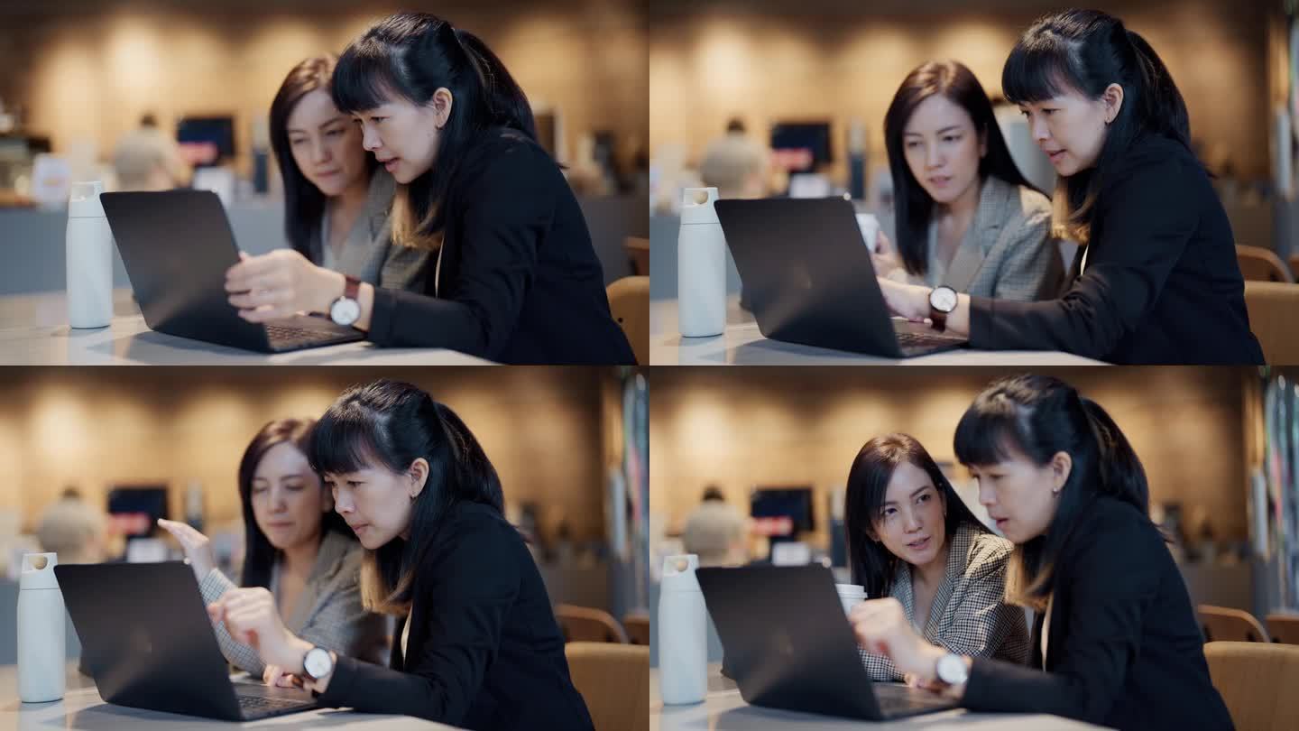 女同事喜欢在咖啡店里一起用笔记本电脑讨论项目计划。