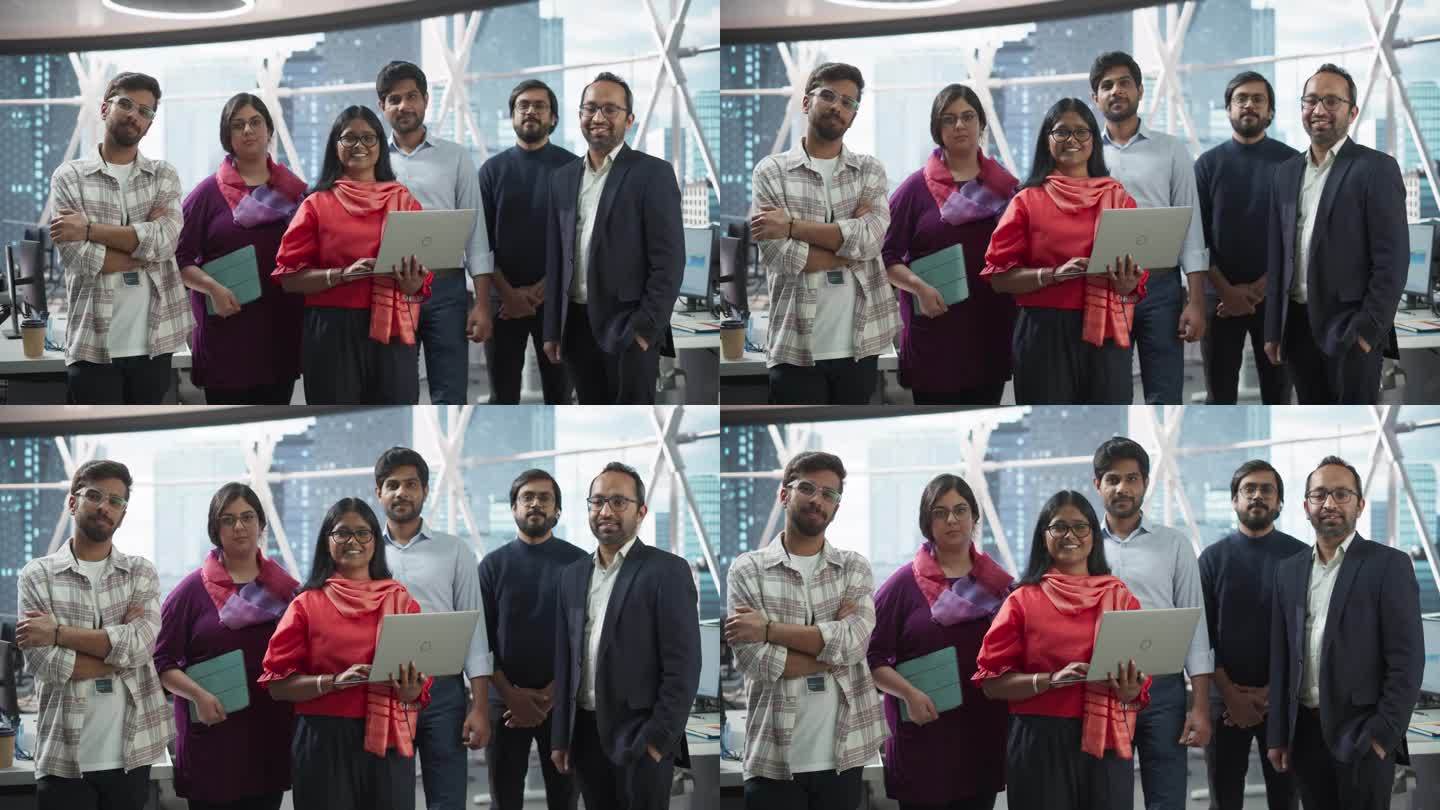 一群快乐的多民族印度团队，男女经理，专家和商业专业人士在镜头前摆姿势并微笑。一个自信的南亚团队领导站