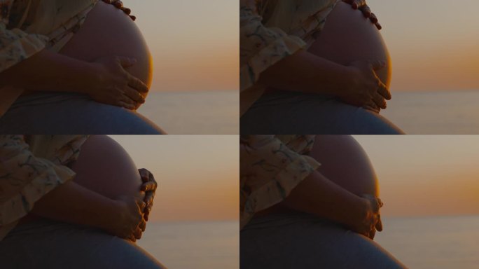 孕妈妈的腹部触碰大海和天空