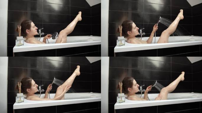 一位女性享受水疗般的体验，放松地泡个澡，在温和的淋浴下小心地洗腿——自我护理和放松。