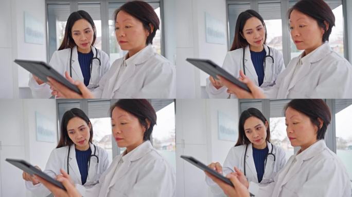 亚洲女医生在私人诊所使用药片
