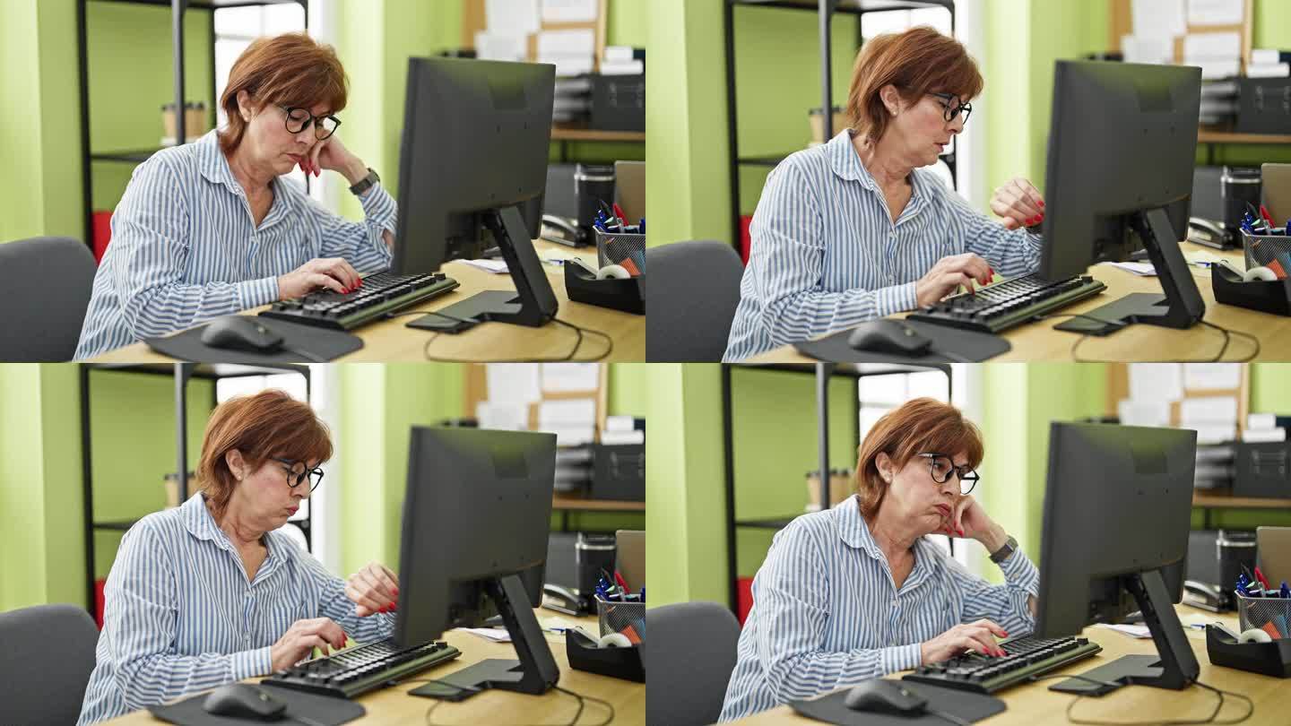 中年女商务工作者在办公室用电脑看手表累了